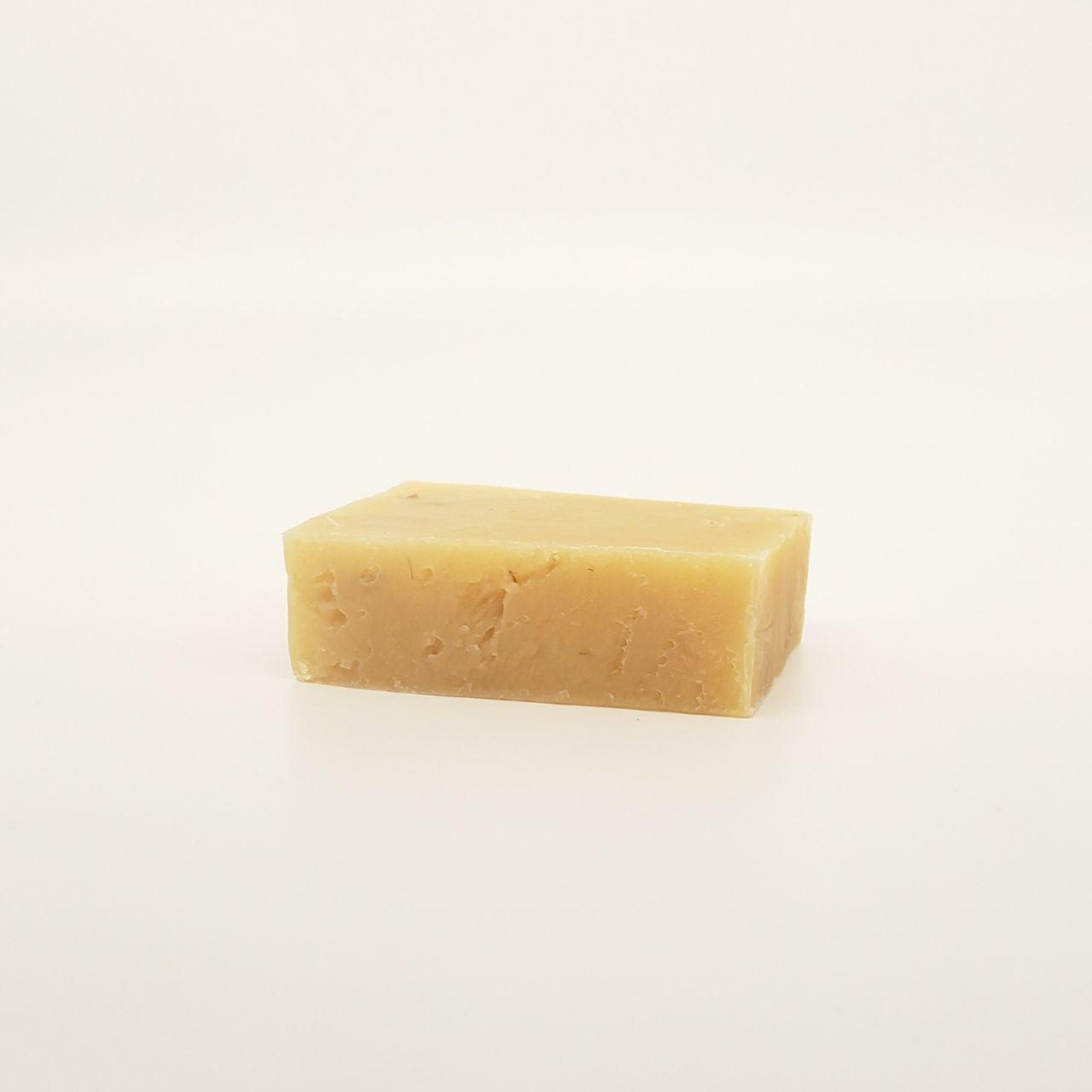 A bar of lemongrass soap on a white background